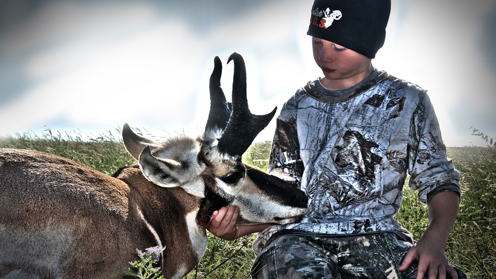 Boy with pronghorn antelope