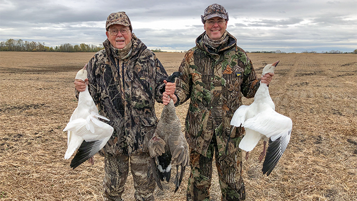 Hunters with geese while hunting in Alberta