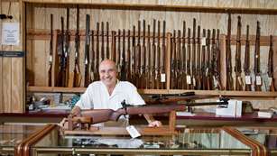 Happy Gun Store Owner
