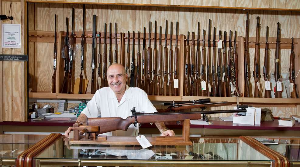 Happy Gun Store Owner