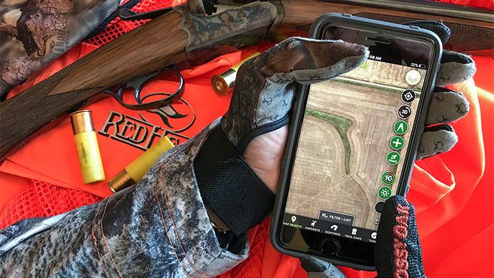 Pheasant hunter using HuntStand smartphone app to plan hunt
