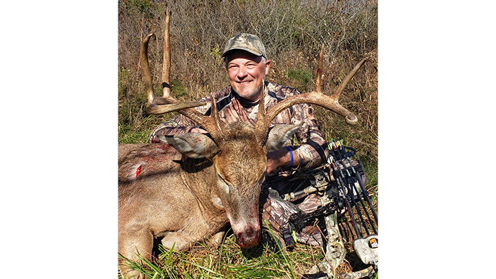 Hunter with Kansas buck taken with Mathews Vertix bow