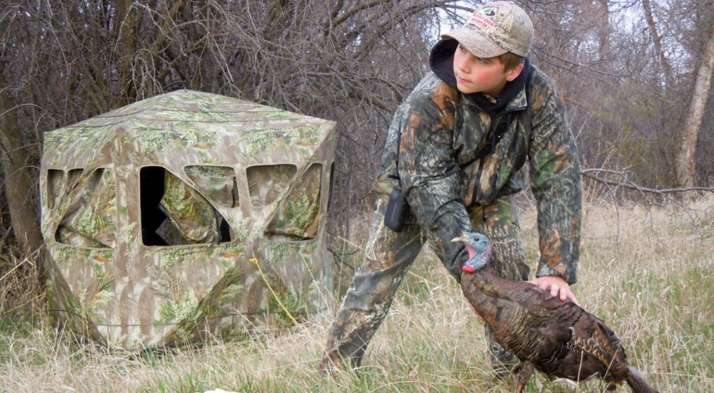 Young Hunter Staking Turkey Decoy