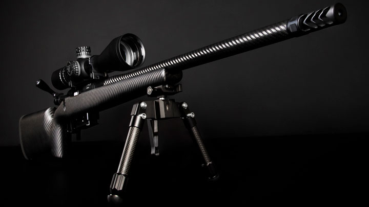 Hardy hybrid with scope on glossy black background.