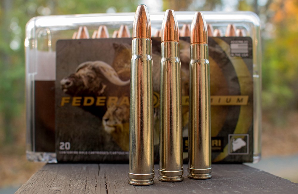 Federal Premium .375 H&H Magnum cartridges on wooden bench.