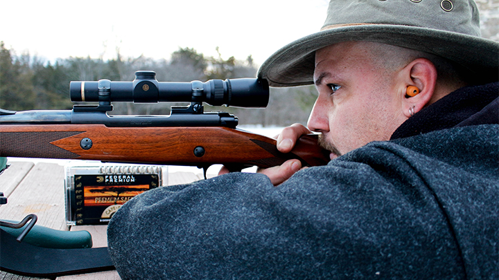 Hunter shooting Winchester Model 70 Super Express in .375 H&amp;H Magnum off bench