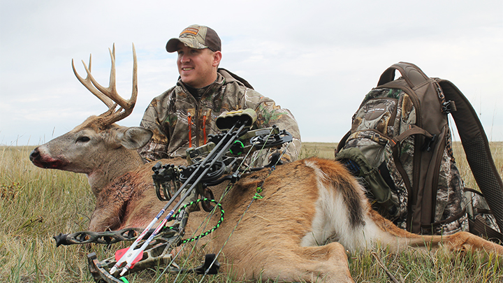 Hunter Holding Posing with Whitetail Deer