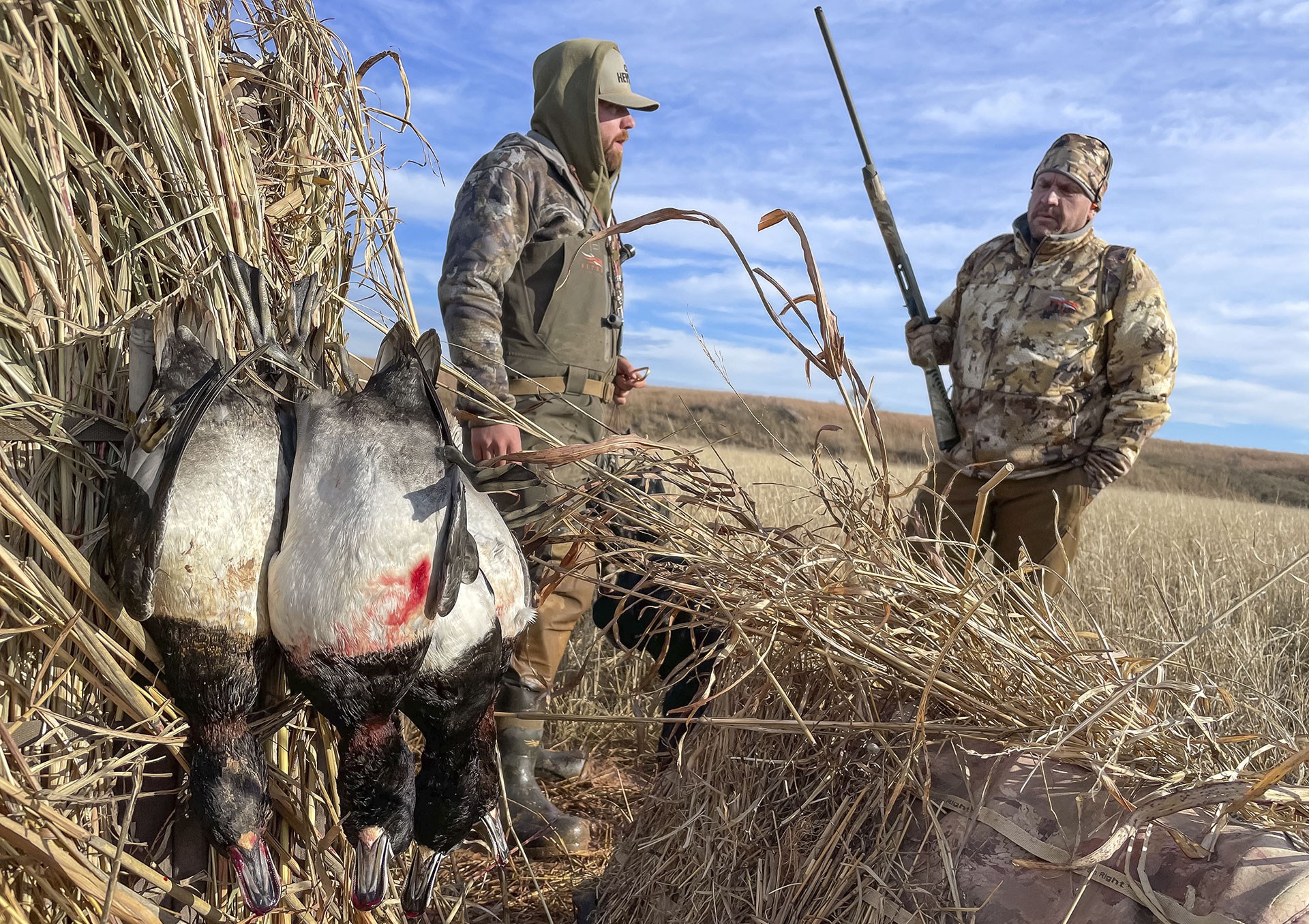 Hunters with their quarry