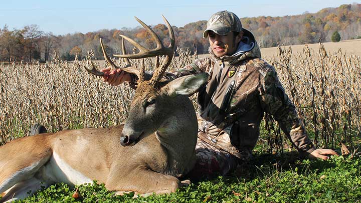 Hunter with whitetail buck