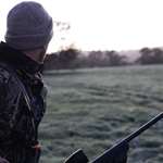 mainman-wearing-gray-and-black-camouflage-jacket-holding-rifle-2954926.jpg