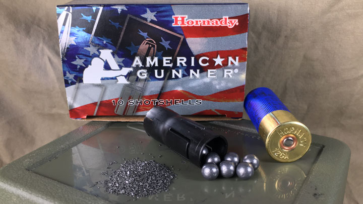 Propellant, shot, and a shotshell lying in front of a Hornady American Gunner Box