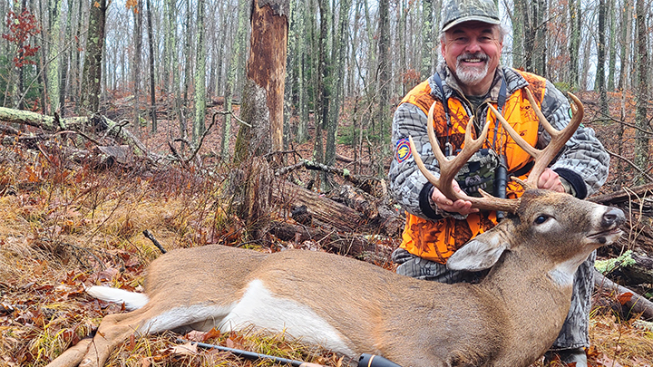 Hunter with large whitetail buck in Connecticut