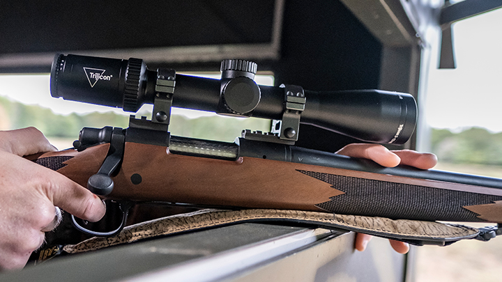 Trijicon Huron Riflescope Atop Rifle Hunter is Using in Deer Stand