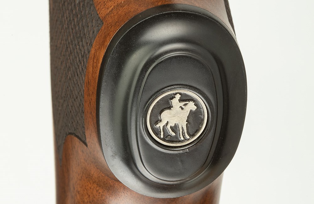 Marlin Model 336 Classic lever action rifle grip with silver Marlin logo engraving.