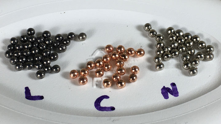 Different types of shot labeled, L (lead), C (copper) & N (nickel)..