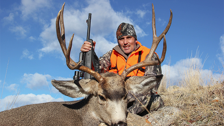 Hunter with Trophy Mule Deer