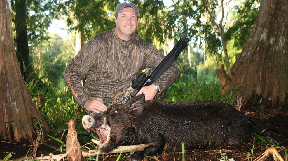 Hunter With Hog