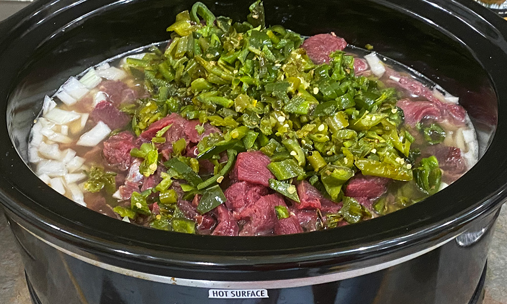 Prepped bear stew ingredients in crockpot ready to cook.