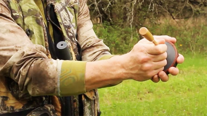 Close Up of Hunter Using Pot Call to Call Turkeys