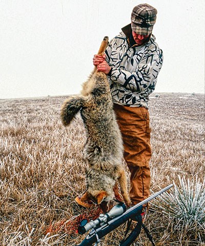 Hunter holding Coyote
