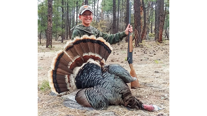 Young hunter with Turkey