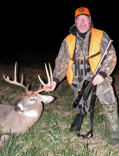 The author, pictured with his reliable Thompson/Center Pro Hunter, a near-constant companion during both firearm and muzzleloader deer seasons throughout the country. (Photo by Nancy Roux)