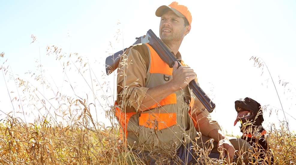 Man Hunting With His Dog In Tall Grass 2026 09 24 14 46 51 Utc