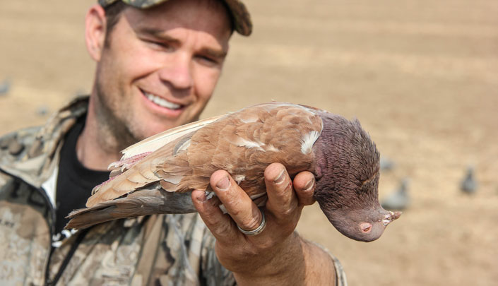 Hunter holding Dove and smiling