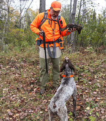 Man with German Shorthair Hunting Dog