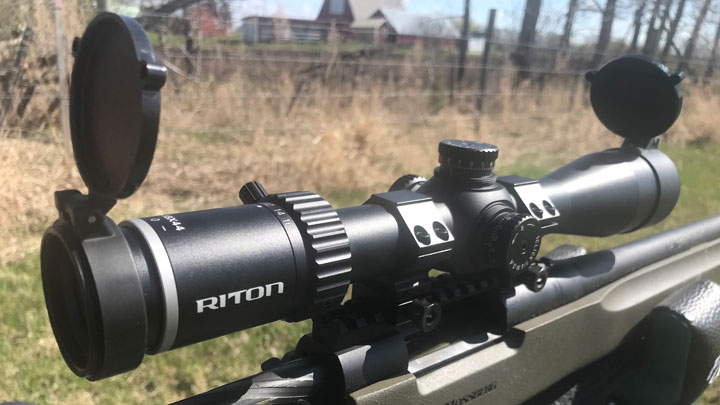 Riton X5 Primal sitting on a green-stocked rifle