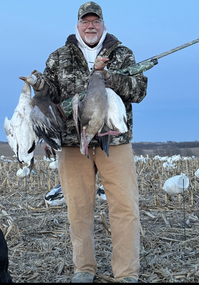 Mike Roux with geese
