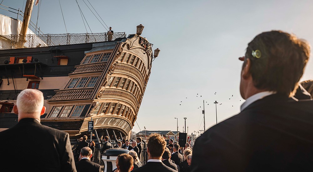 Male delivering speech from HMS Victory ship.
