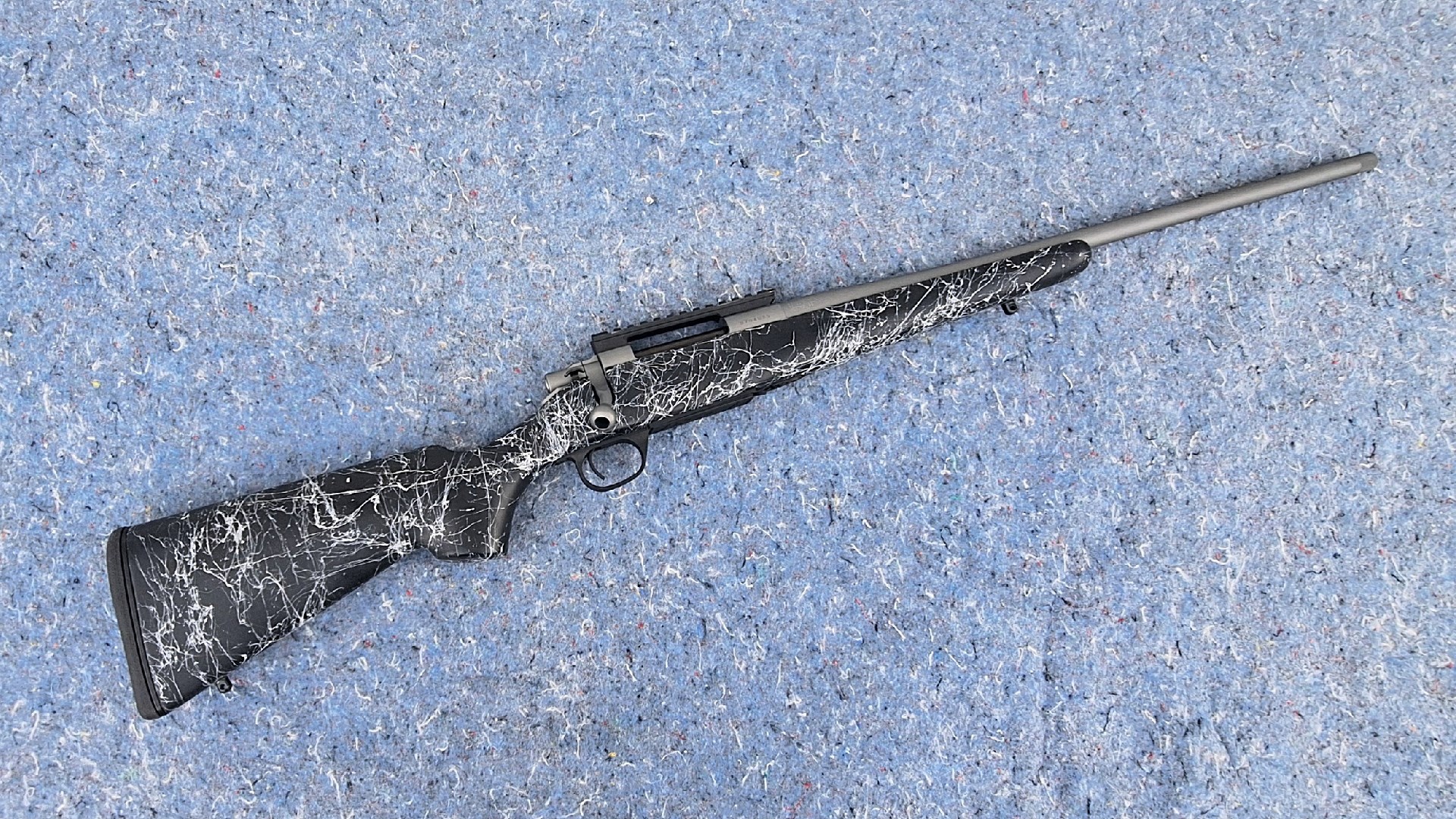 Gun on mat