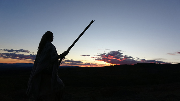 Silhouette of hunter in backcountry