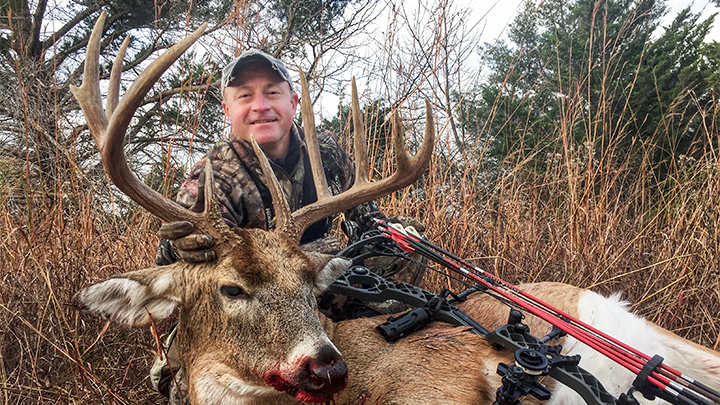 Hunter with Whitetail Buck Killed with Bow