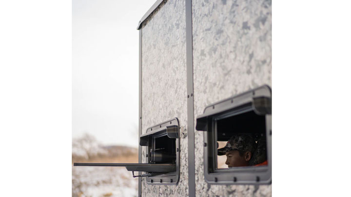 Hunter peeking out of Double Down box blind