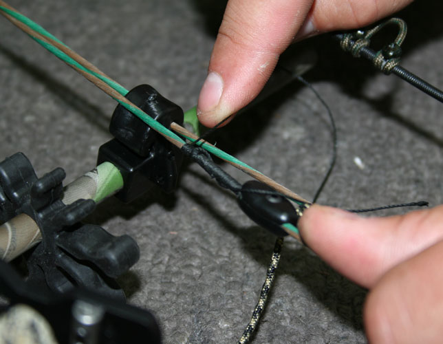 Attach the rest’s down cord to the bow’s cable