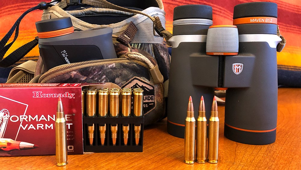 Maven binoculars beside Hornady Superformance Varmint ammunition.