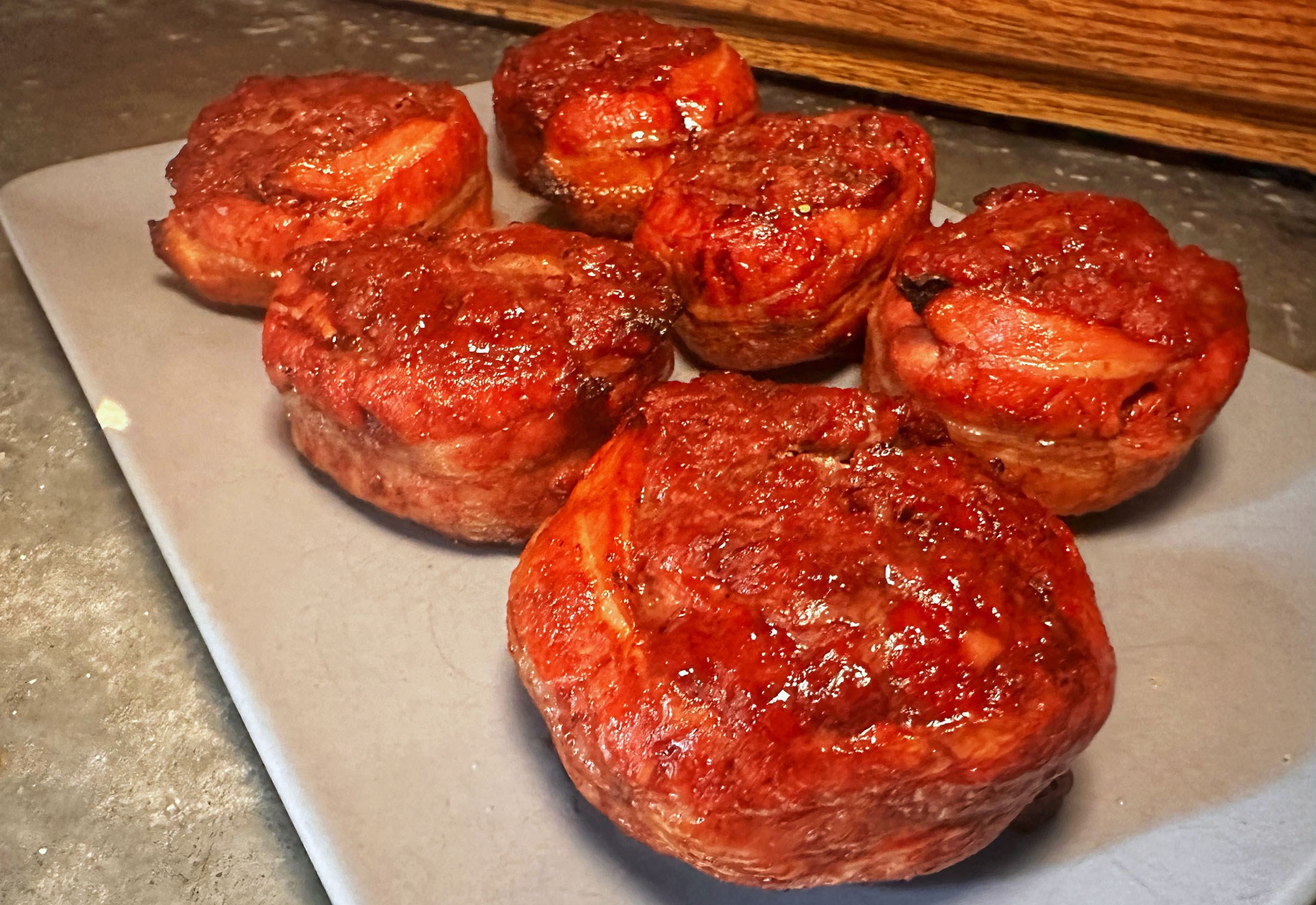Bacon rolled elk burgers