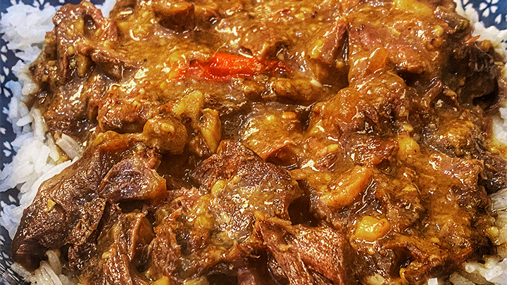 Asian Braised Elk Shank Over Rice in Bowl