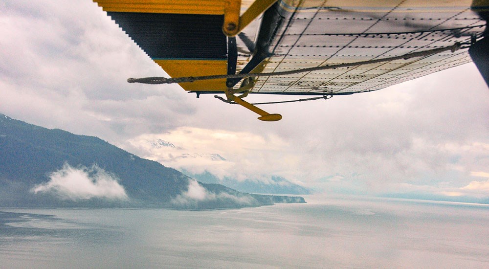 Bush Plane Flying Over Island