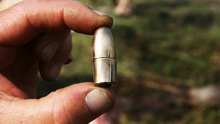 Hunter Holding Bullet Close-Up