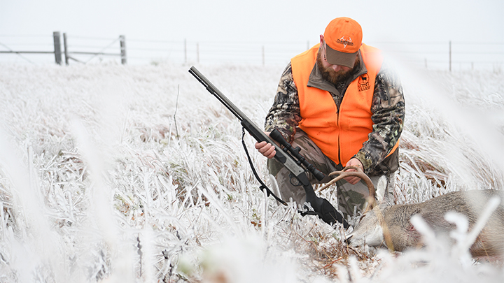 Hunter Admiring Whitetail Buck Taken in Oklahoma